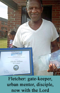 Fletcher holding awards - gate-keeper, urban mentor, disciple, now with the Lord