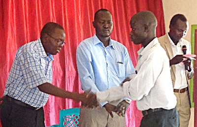 Three seminary-trained leaders present diplomas