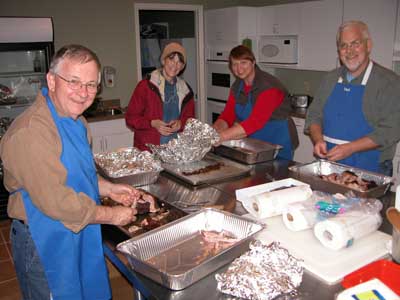 Kitchen workers assembling food boxes