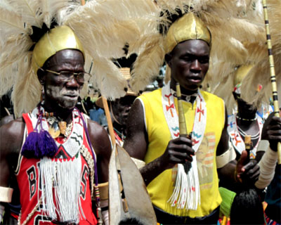 African man wearing a mix of tribal wear and a Bulls Basketball shirt
