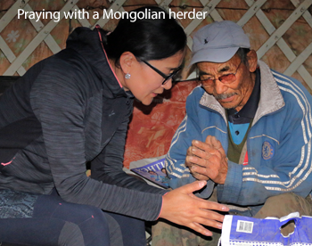 Praying with a Mongolian herder